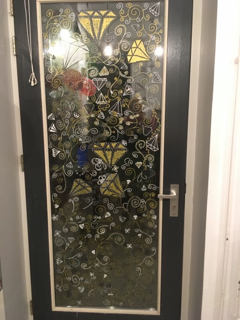 Door with decorated door window